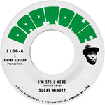 the album cover for Sugar Minott - I'm Still Here B/W I'm Still Here - Version
