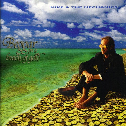 the album cover for Mike & Mechanics - Beggar On A Beach Of Gold
