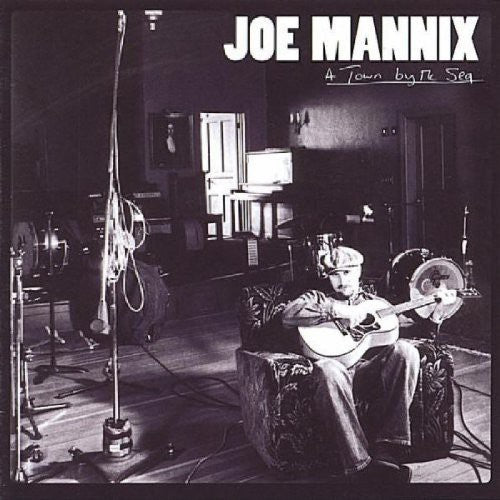 the album cover for Joe Mannix - Town By the Sea