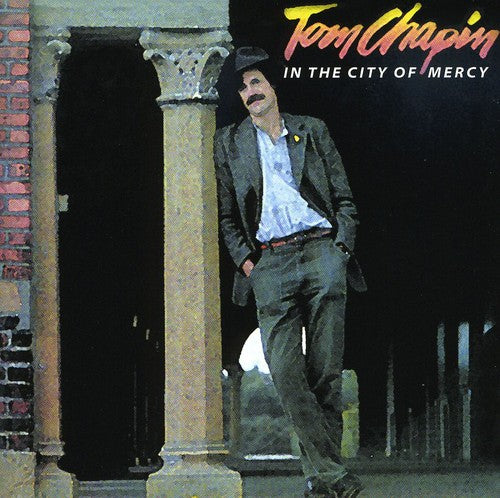 the album cover for Tom Chapin - In the City of Mercy