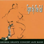 the album cover for George Gruntz Concert Jazz Band - Tiger By the Tail