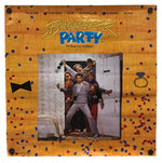 A square framed art print featuring a colorful graphic design inspired by the movie 'Bachelor Party'. The print has a light wood-grain textured border decorated with small red, blue, and black confetti, a black bow tie on the left, a ring on the right, and the title 'Bachelorette' in yellow and blue script at the top.
