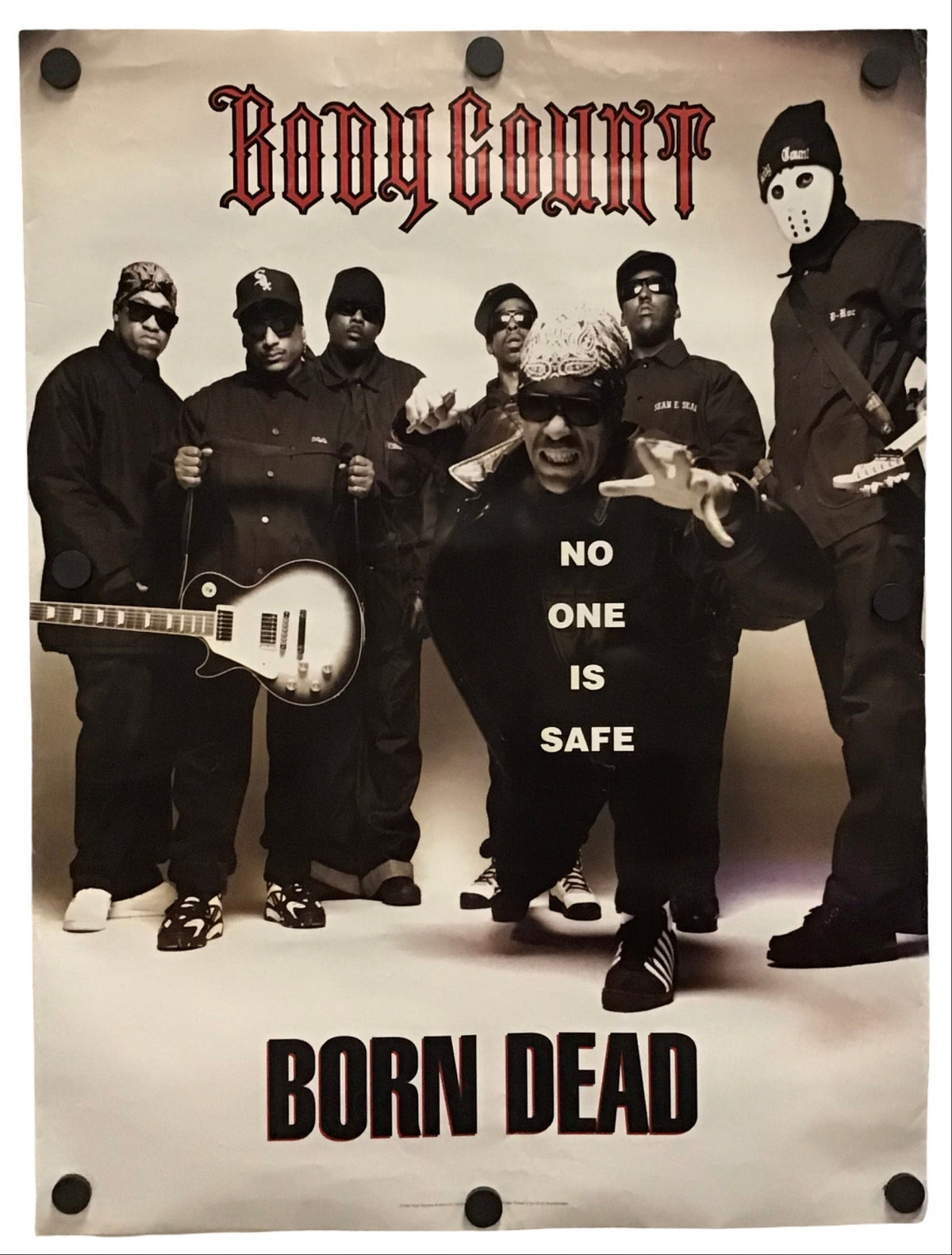 A rectangular poster featuring the band Body Count with a sepia-toned group photo, red gothic 'Body Count' text at the top, and 'BORN DEAD' in large black letters at the bottom. The poster is shown hanging against a plain white background with visible wall holes and a slight drop shadow.