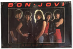 A vintage-style Bon Jovi band poster or banner hanging against a plain white background. The black poster features the band members in a central photo, with 'BON JOVI' in large red letters across the top and small red text at the bottom.