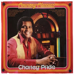Charley Pride 'Country Classics' vinyl record album cover, featuring a portrait of the artist in a red shirt and beige vest in front of a jukebox, with a red and orange border.