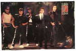 A vintage Duran Duran band poster featuring the five members in black outfits, with a tiger on a leash at the bottom right and the 'Duran Duran' logo in the top right corner, displayed against a white background.