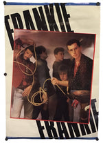 A vintage Frankie Goes to Hollywood poster featuring a group photo of the band with large black 'FRANKIE' text on a cream background, photographed against a white backdrop.