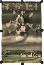 A rectangular wall banner or flag with black corner and edge clips, featuring a sepia-toned surreal photo of three people riding a dog against a cloudy sky, with the text 'GEGGY TAH' at the top and 'Sacred Cow' at the bottom.