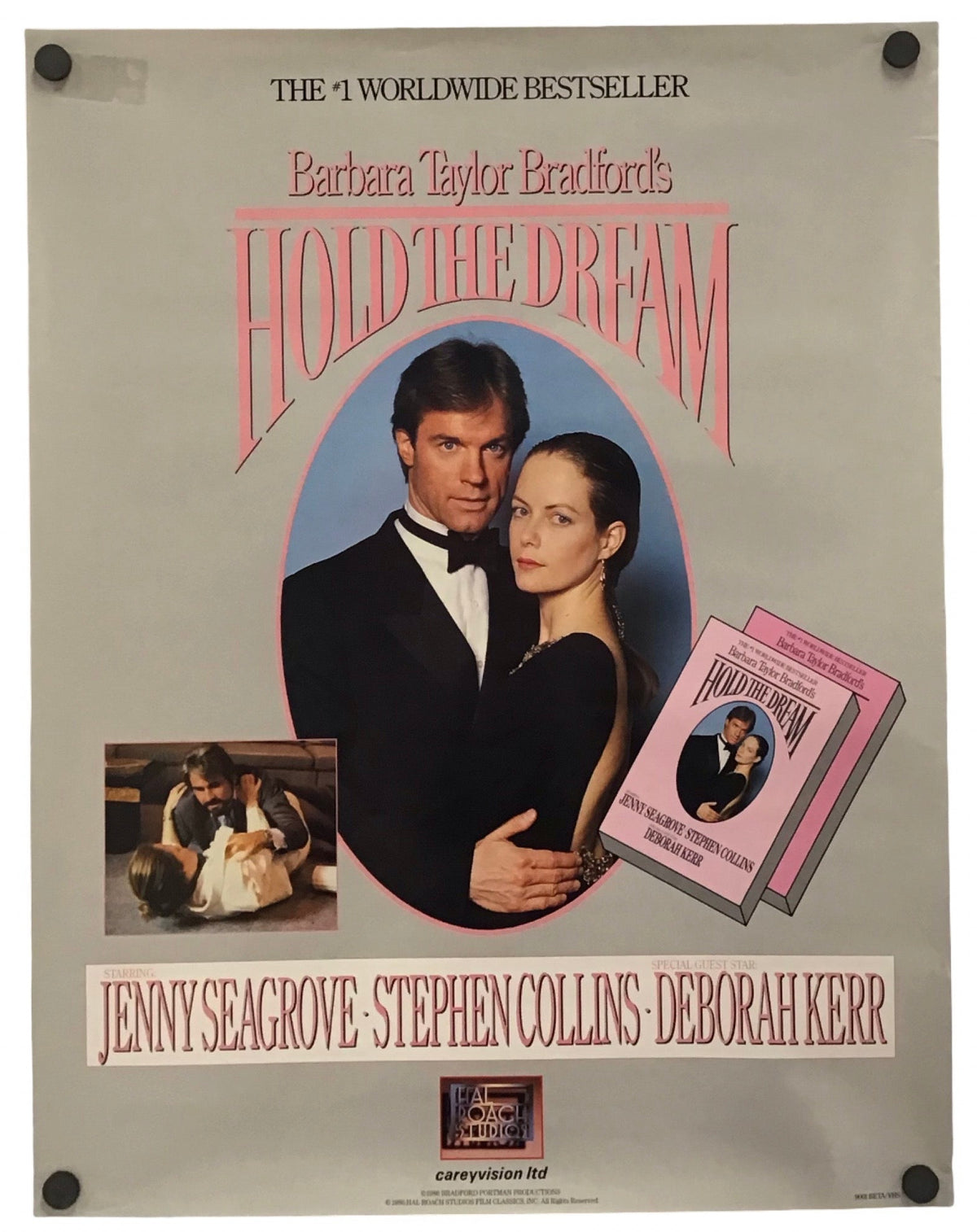 A vintage book cover for 'Hold the Dream' by Barbara Taylor Bradford, featuring a portrait of a man and woman in formal wear, pink title lettering, and author names Jenny Seagrove, Stephen Collins, and Deborah Kerr on a light gray background.