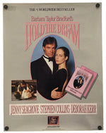 A vintage book cover for 'Hold the Dream' by Barbara Taylor Bradford, featuring a portrait of a man and woman in formal wear, pink title lettering, and author names Jenny Seagrove, Stephen Collins, and Deborah Kerr on a light gray background.