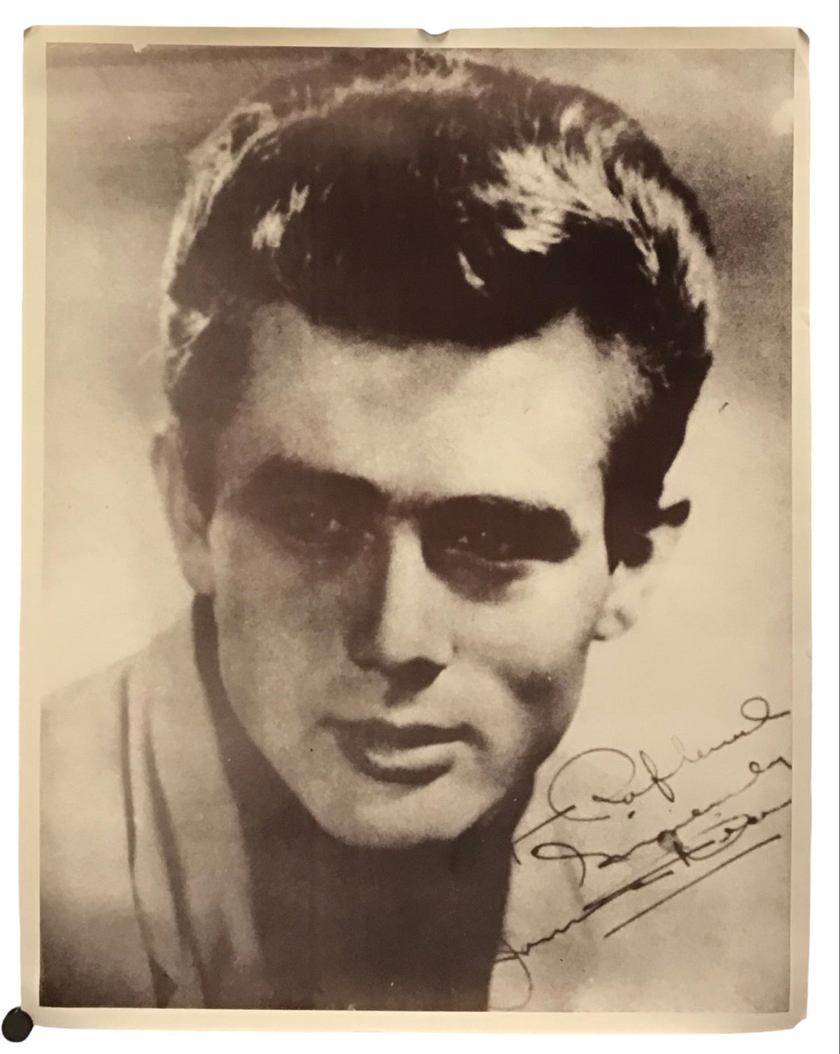 A vintage black and white portrait print of a young man, signed in the lower right corner, displayed against a plain white background.
