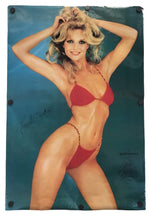 A vintage glossy poster featuring a blonde woman in a red bikini posing against a teal-blue background, with visible mounting holes in the corners and printed signatures.