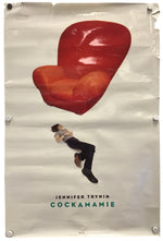 A vintage-style movie poster for Jennifer Trynin's album 'Cockamanie' pinned to a white wall. The poster features a large, glossy red armchair floating above a small illustration of a man falling, with the title and actor's name printed at the bottom.