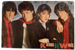 A vintage band poster for Katrina and the Waves, featuring the four band members