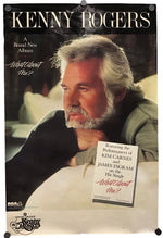 A vintage Kenny Rogers album poster for 'What About Me?' featuring a portrait of the artist, with text and a small printed insert card, photographed against a light neutral background.