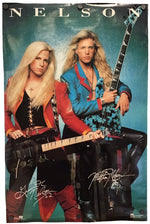A signed Nelson band poster featuring Jim Morrison and David Gilmour on a teal background, with 'NELSON' printed at the top and autographs at the bottom.