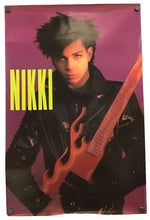 A vintage-style Nikki Lee poster featuring a photo of the musician holding a flame-shaped electric guitar against a purple background, with the name 'NIKKI' in bold yellow letters.