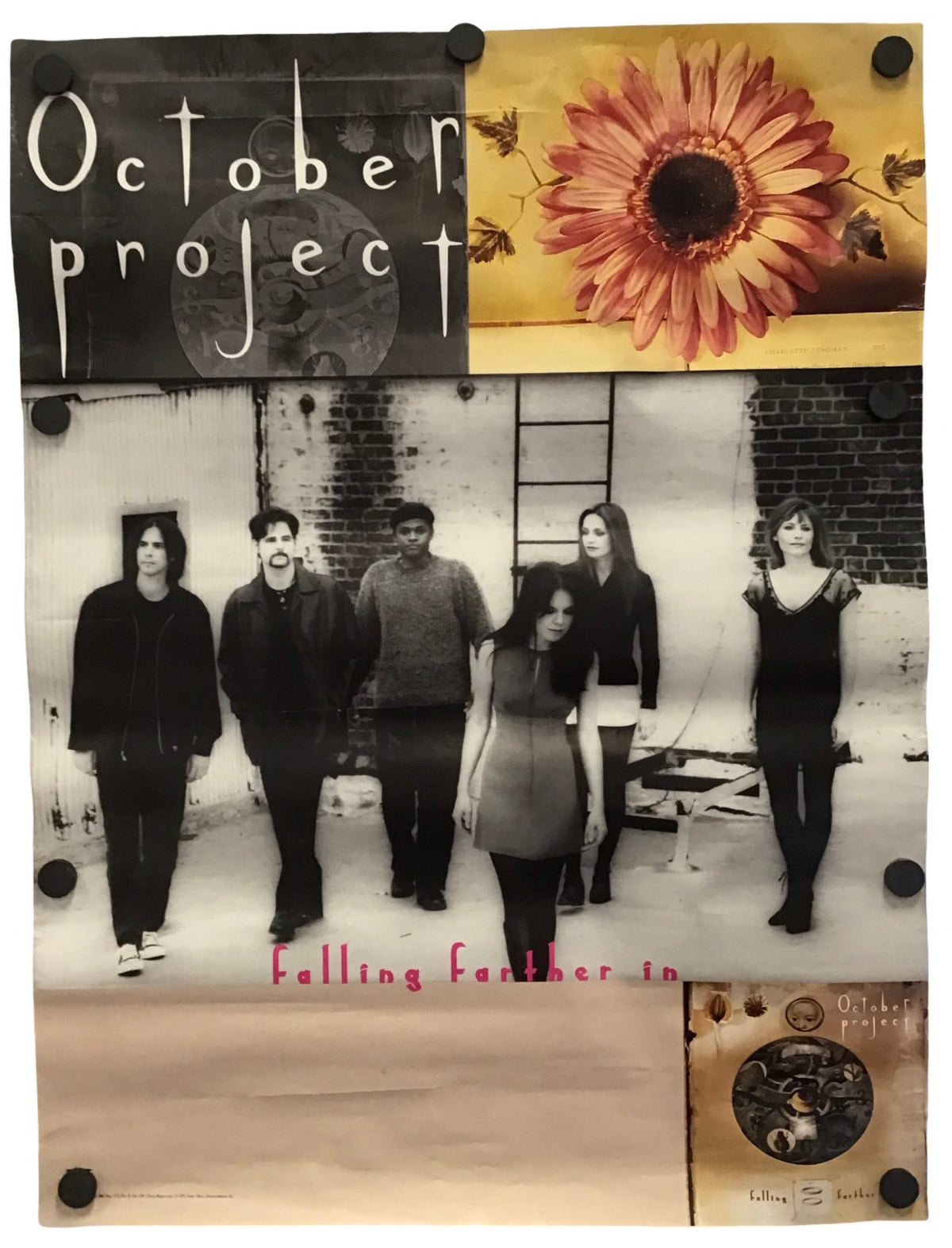 A square collage-style poster or print featuring a black-and-white group photo of six people, a large sunflower on a mustard background, the words 'October project' in white script on a black block, and a beige lower section with small pink text and a circular inset image. The print is photographed against a plain white background.
