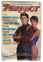 A vintage concert poster for the soundtrack album 'Perfect' featuring Jermaine Jackson and Cher, with artist names listed on a cream-colored background and held together by visible metal clips at the corners.