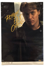 A signed Robert Ellis Orrall poster print featuring a portrait of the actor with yellow script autograph text, displayed against a plain white background.