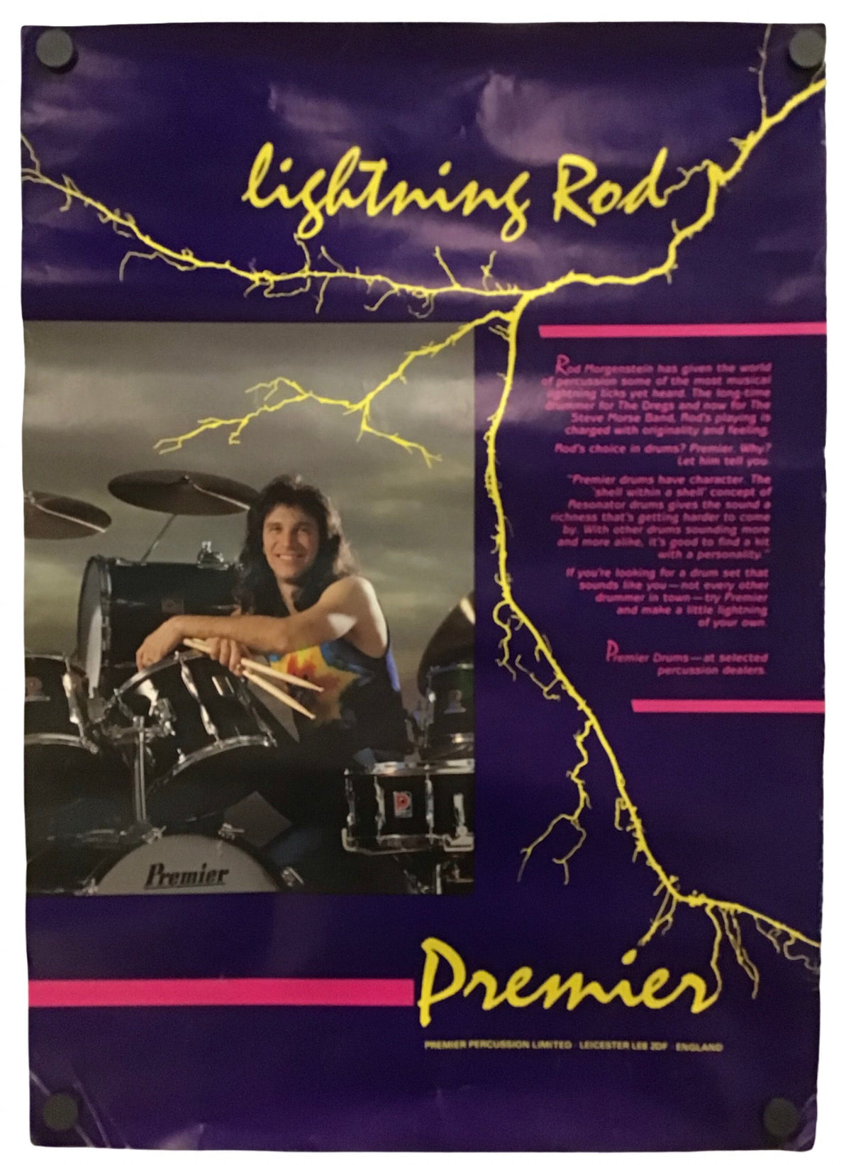 A vintage-style poster or print featuring a drummer seated behind a drum kit, with purple background, yellow lightning graphics, and the text 'Lightning Rod' and 'Premier.' The product appears to be the printed poster itself rather than a real-world scene, so this fits Scenery per the schema because the depicted artwork is the product.