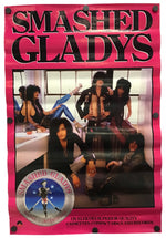 A vintage-style Smashed Gladys album cover or poster with a bright pink border, large black text reading 'SMASHED GLADYS' at the top, and a central band photo. A circular Smashed Gladys logo appears at the lower left.