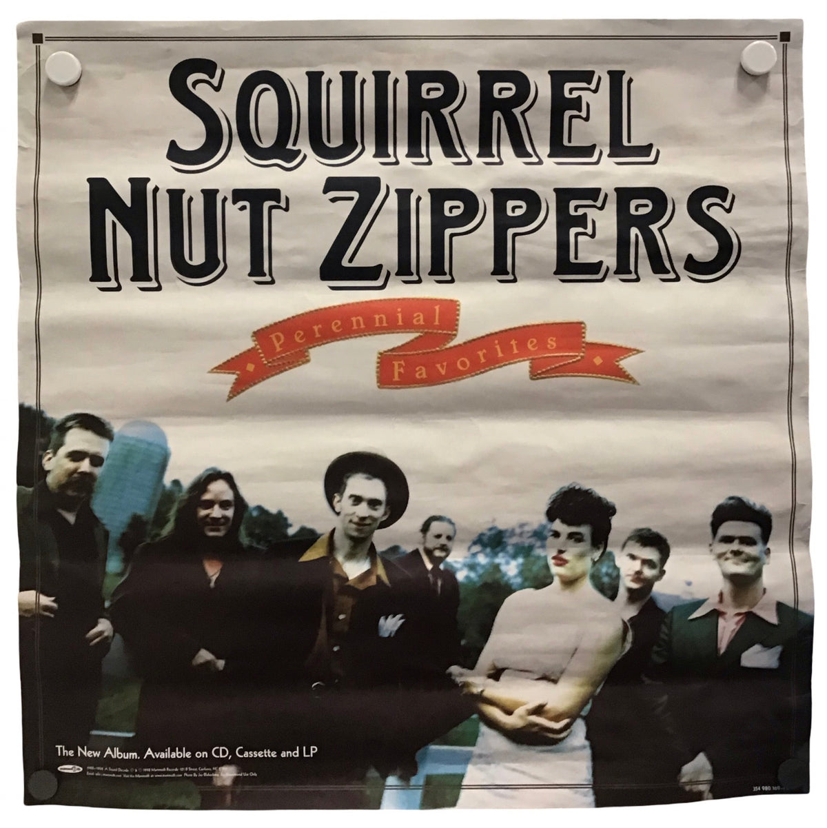 A vintage-style poster or banner for the band Squirrel Nut Zippers, featuring large black text at the top and a group photo of the band members below on a light beige background.
