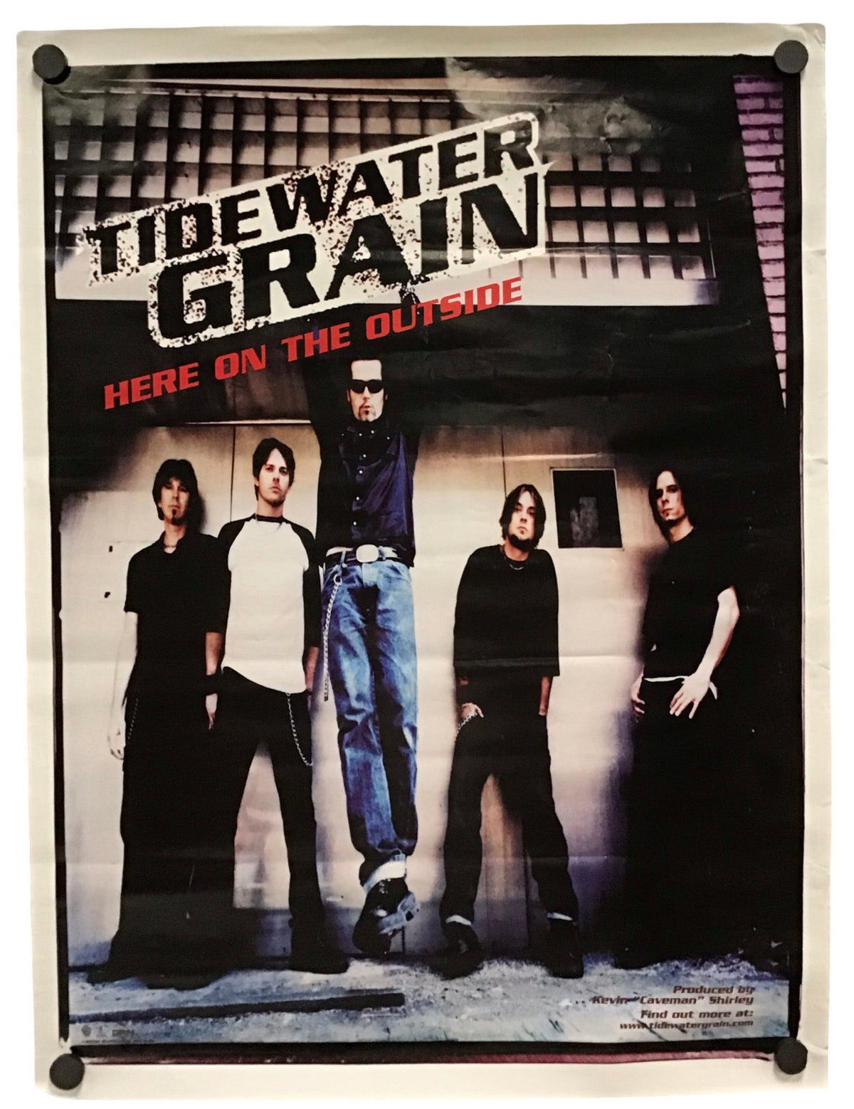 A vintage band poster for the rock group 'Tidewater Grain' from their album 'Here on the Outside', displayed on a white background with black corner fasteners.