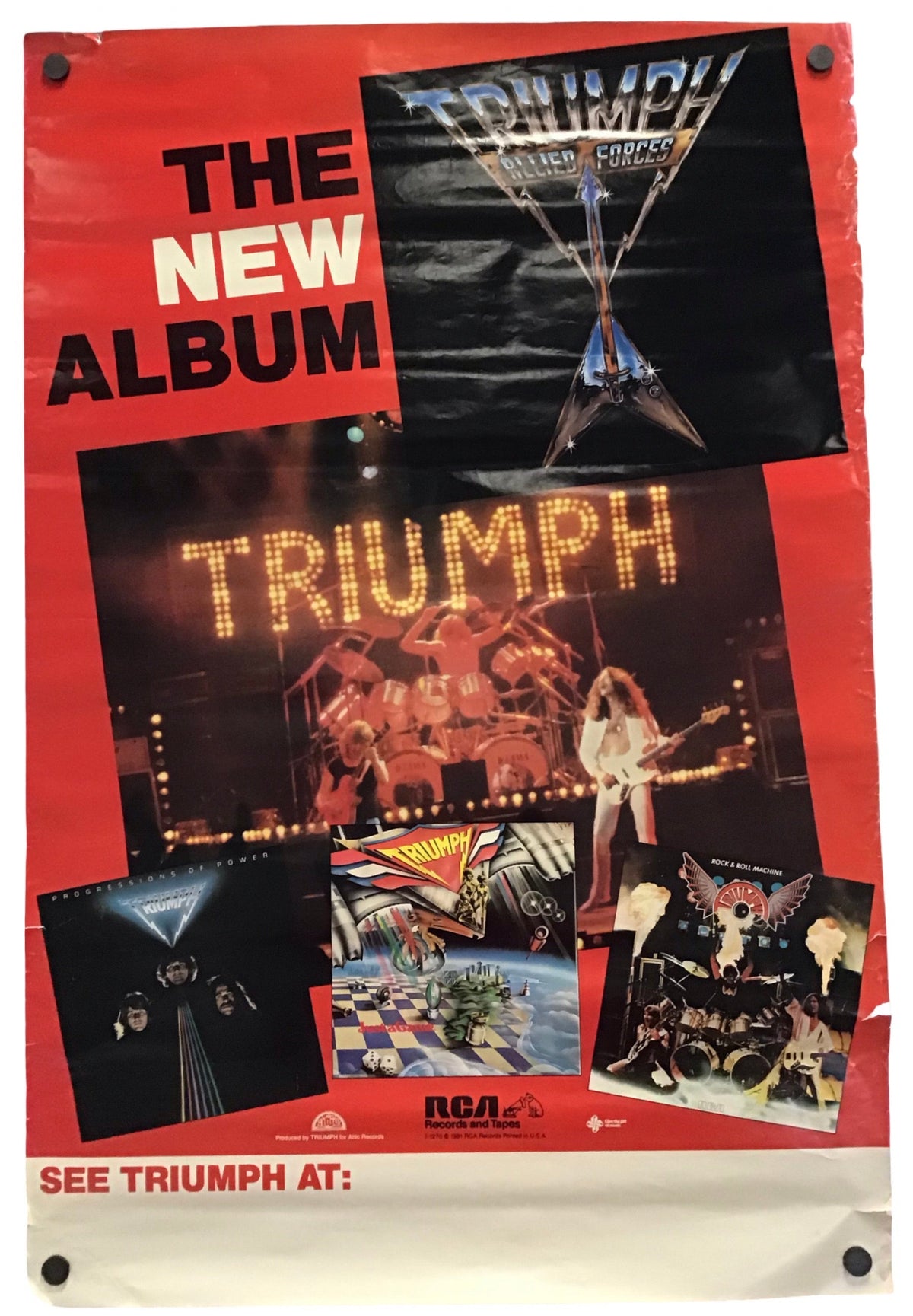 A vintage-style Triumph band poster with a red background, large text reading 'THE NEW ALBUM,' and multiple album-cover images and a lit 'TRIUMPH' sign. The poster is photographed hanging against a white wall with visible wall studs and a slight drop shadow.